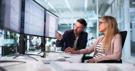 Medical Billing Specialists In Office Using Desktop Computers For Coding.の写真素材