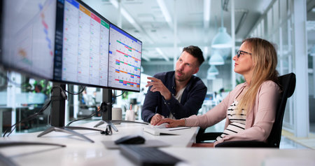 Man And Woman Using Kanban Project Management Software On Computer.の写真素材