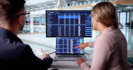 Healthcare Professionals Collaborate On Coding For Financial Audit Report Analysis.の写真素材