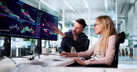 Professional Trader Analyzing Stock Market Trends On Multiple Computer Screensの写真素材