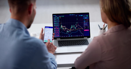 Young Couple Trading Stocks On Laptop, Potential Stock Market Brokers.の写真素材