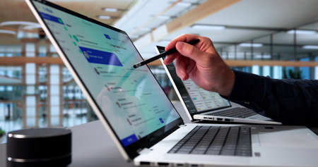 Elderly Man Multitasking With Email App On Laptop At Office.
