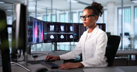 Surgeon Reviews X-ray Scan On Computer Screen Before Knee Surgery.