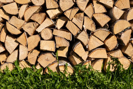 Firewood close-up - chopped and stacked on the streetの写真素材