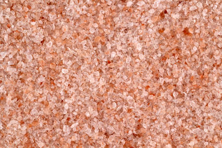 Pink fine salt background and texture for design. View from aboveの写真素材