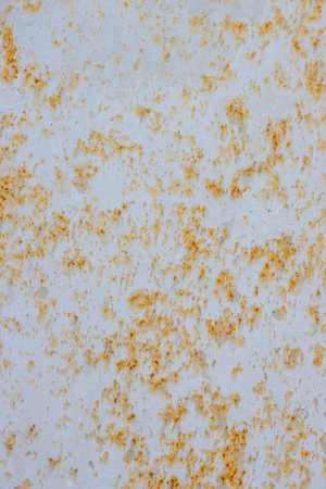 Painted light rusty metal surface with peeling paint.