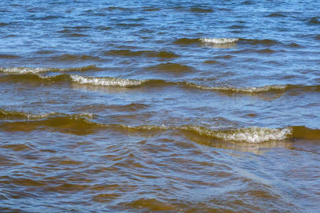 Water surface with small shallow waves. Beautiful seascape