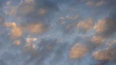 Clouds at sunset, scenic textured background for design.