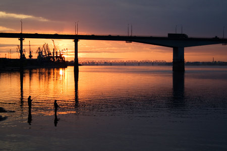 Sunset on city river. Fishermans. Bridge
