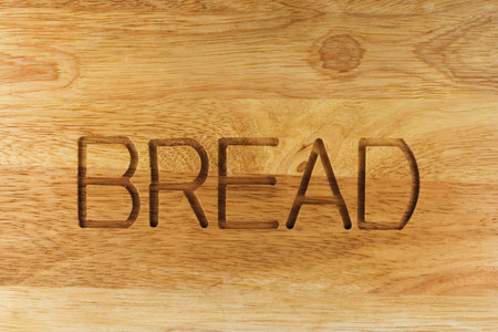 Wooden box for bread with text. CLose-up.の写真素材