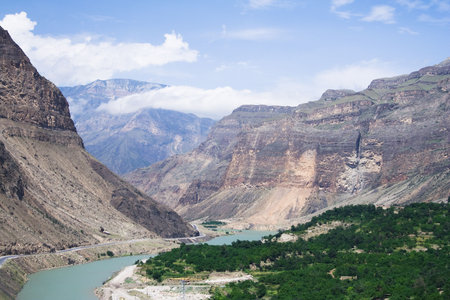 Mountains at the blue sky. Green river. の写真素材