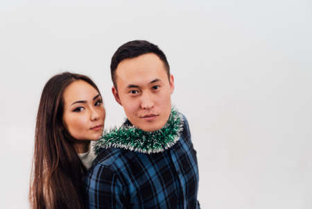 He vs She full length portrait of attractive, playful, cheerful, couple in casual outfit jumping with opened mouths over white backgroundの写真素材