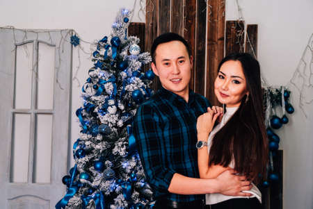 A guy with a girl is celebrating Christmas. A loving couple enjoy each other on New Years Eve. New Years love story.の写真素材