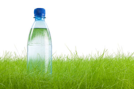 Bottle of water with drops isolated on white の写真素材