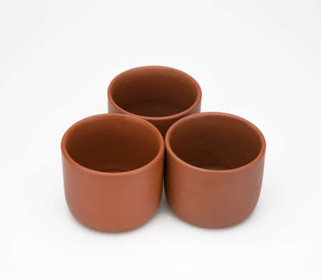 three clay cup isolated on white backgroundの写真素材