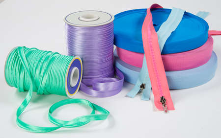 Still life with sewing accessories, isolated on white background