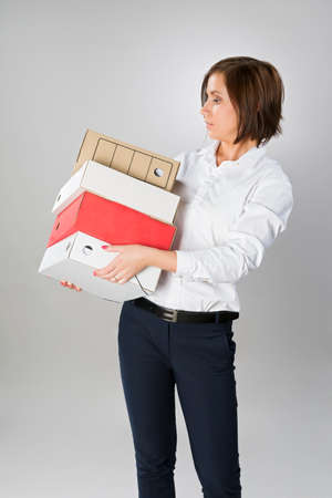 secretary woman with a large stack of foldersの写真素材
