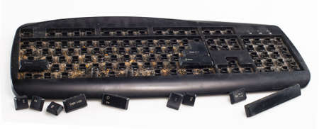 entirely dirty keyboard on white backgroundの写真素材