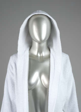 mannequin in a white coat on a gray backgroundの写真素材