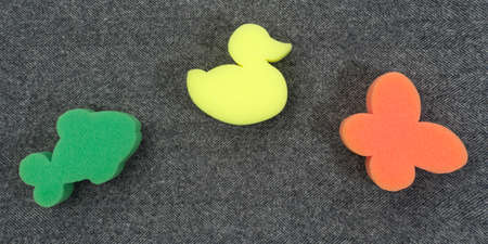 foam toy on fabric background. fish, bird, insect