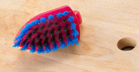 plastic brush with bristles for cleaning surfaces from dirt