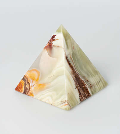 souvenir, onyx pyramid, on white background.の写真素材