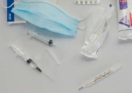 medications for treating a patient lie on a bedside table. a fragment of a hospital ward
