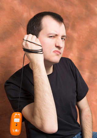 guy holds a computer mouse in his hand