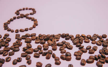 figure 8 from coffee beans on a bright lilac background and a lot of of space for text.