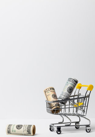 Side view of money banknotes and basket on a white background.の写真素材