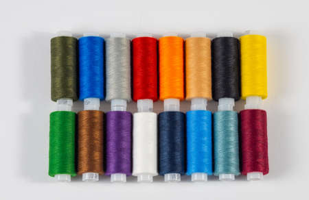 Multi-colored spools of thread. Close-up. View from above