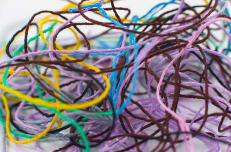Close-up of colored threads on a white background. Macro, fiber, cotton.の写真素材