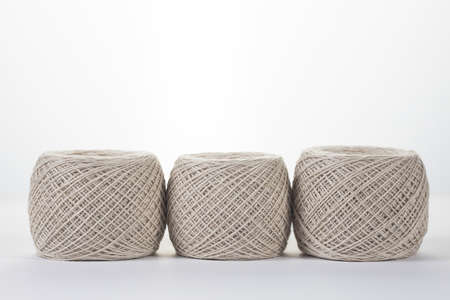 balls of yarn of light gray on a white background. Handmade recycle ecological concept