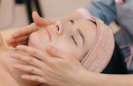 Beautiful woman having a facial massage.の写真素材