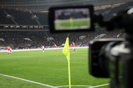 Live broadcast of a football match.The view through the camera screen.のeditorial素材