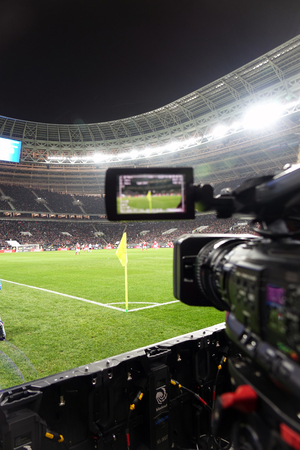 Live broadcast of a football match.The view through the camera screen.のeditorial素材