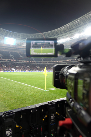 Live broadcast of a football match.The view through the camera screen.のeditorial素材