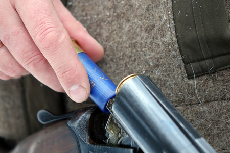 Hunter with gun and hunting ammunition. Hunting season.の写真素材