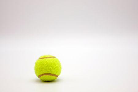 Tennis ball on white background.Sports equipment.の写真素材
