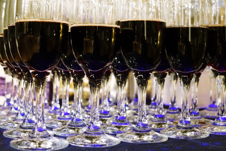 Glasses with red wine .The rows of glasses .の写真素材