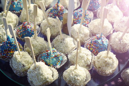 Chocolate candy with nuts, seeds and coconut flakesの写真素材