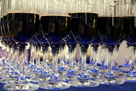 Glasses with red wine .The rows of glasses .の写真素材