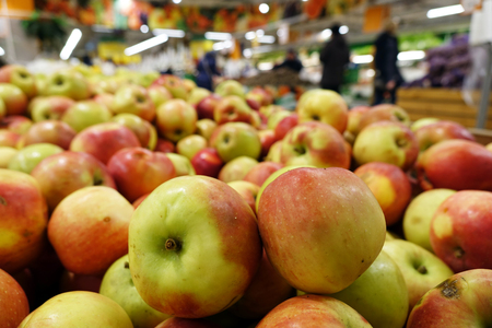 Fruit trading in the store .ripe apples in the grocery store or on the marketの写真素材