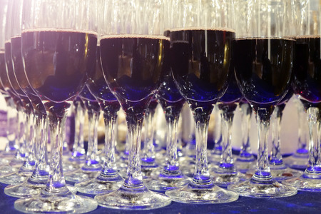 Glasses with red wine .The rows of glasses .の写真素材