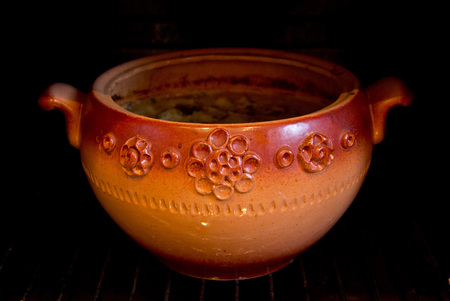 Ceramic pot on a black background. Crockery.の写真素材