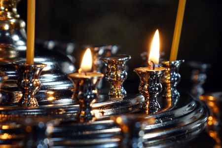 Burning candles in the Church . Religion