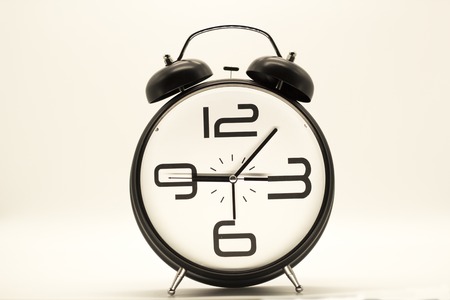 alarm clock on white background. hoursの写真素材