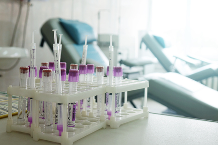 Blood test tubes. Medical equipment for blood donors.Chairs in the office for blood donation.の写真素材
