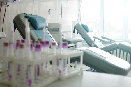 Blood test tubes. Medical equipment for blood donors.Chairs in the office for blood donation.の写真素材