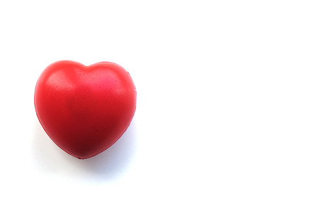 A red heart isolated on white background. Symbol of love.の写真素材